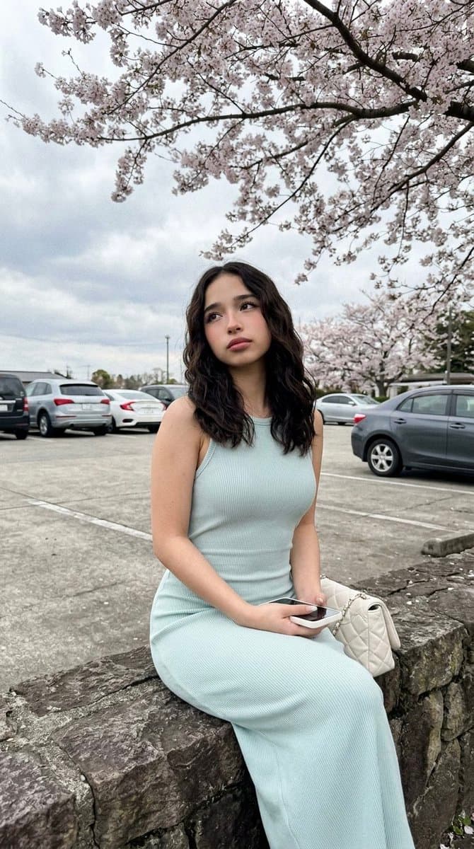 Cherry Blossom Parking Lot Portrait Prompt — example 1