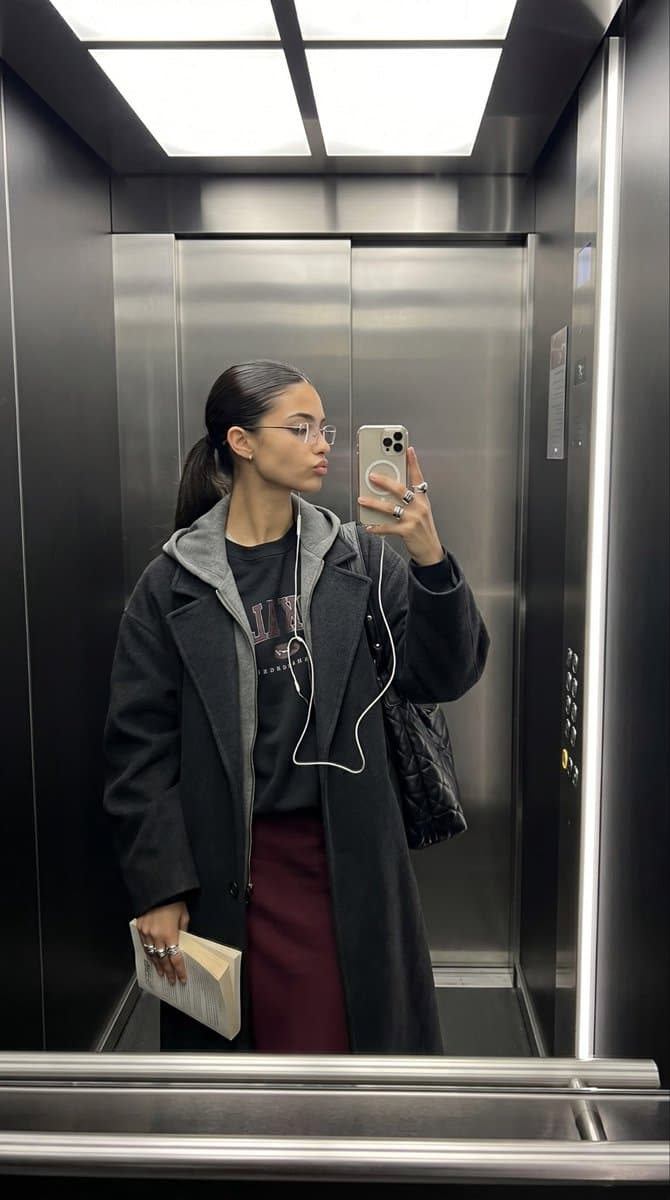 Elevator Mirror Selfie with Book — example 1