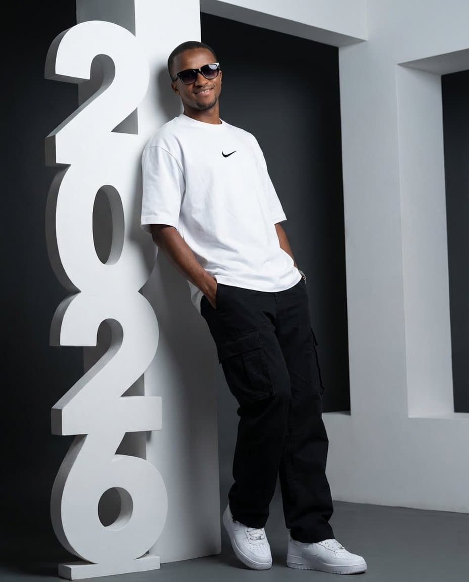 Low-Angle Streetwear Portrait with Architectural Text — example 1